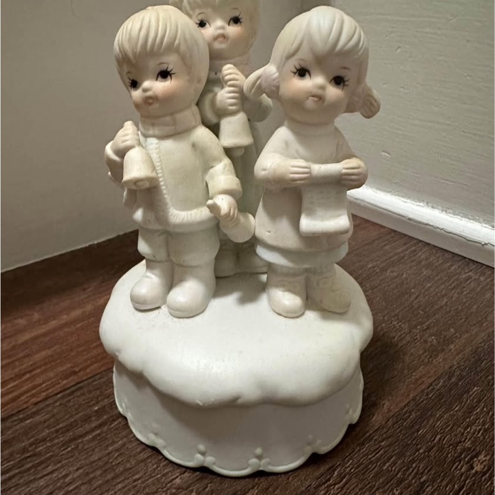 Charming White Ceramic Figurine music box